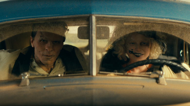 Frankenstein and the Bride driving a dusty old car in The Bride!