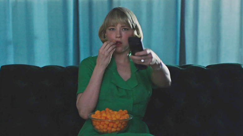 Haley Bennett as Hunter eating cheeseballs while watching TV in Swallow