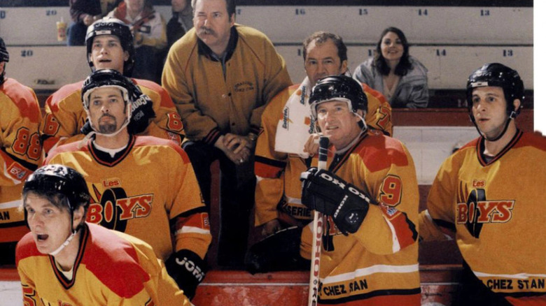 The cast of "Les Boys" watching hockey