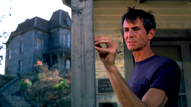 Norman Bates older raises hand