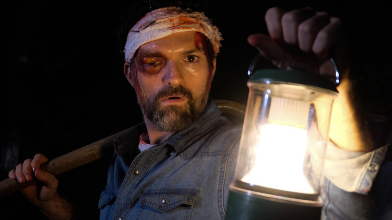 A Wounded Fawn's Bruce injured holding lantern