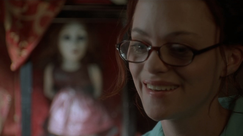 Angela Bettis looks in a divided reflection like May Dove Canady in May