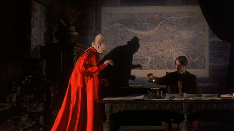 Dracula (and his shadow) menace Jonathan Harker in Bram Stoker's Dracula