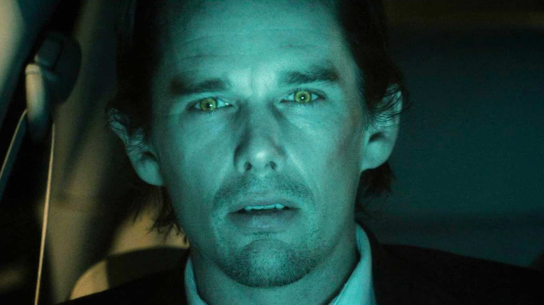 Vampire Edward Dalton bathed in blue-green light in Daybreakers