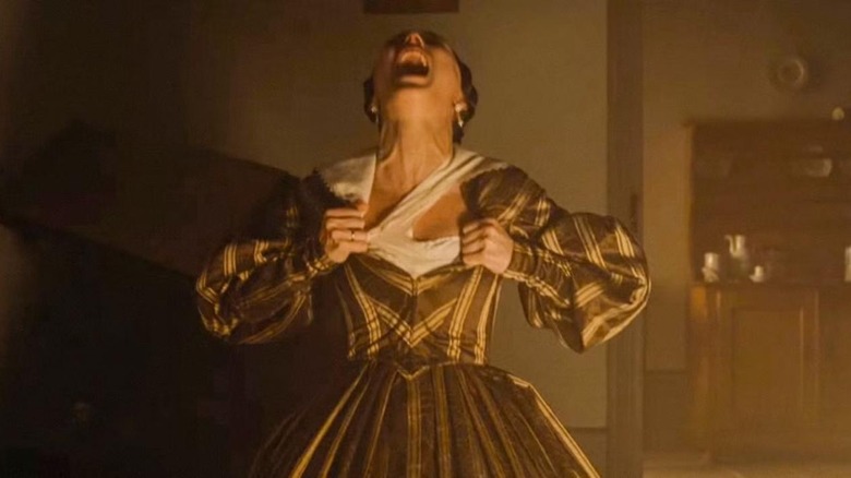 Ellen tearing at her clothes in Nosferatu (2024)