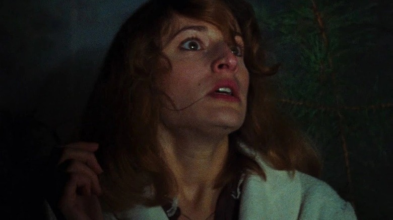 Cheryl looking scared in forest