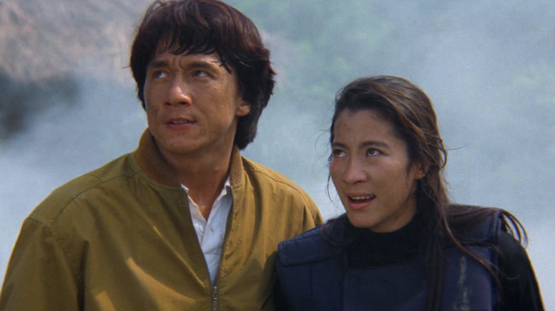 Jackie Chan and Michelle Yeoh look tired among smoke in Police Story III: Supercop