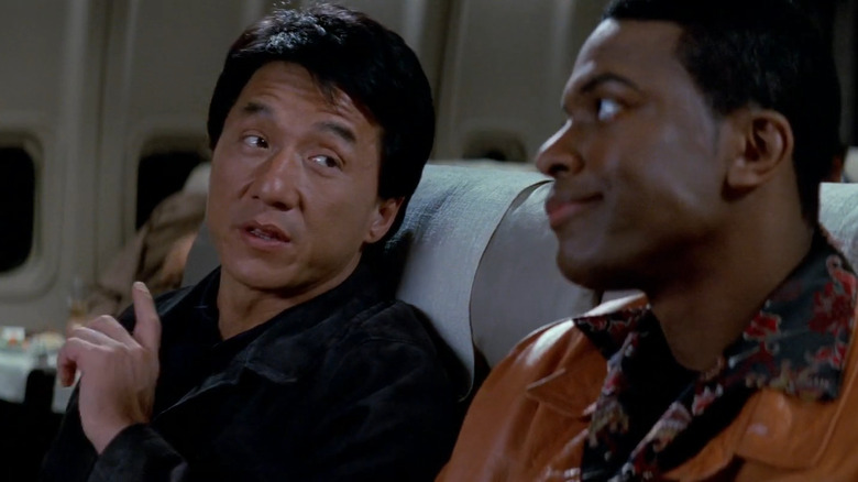 Jackie Chan as Lee talking to Chris Tucker as Carter on a plane in Rush Hour 2