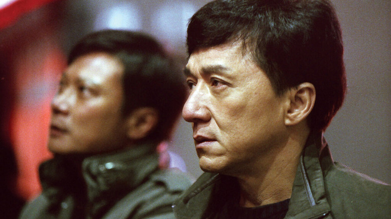 Steelhead (Jackie Chan) looks somberly in a street in Shinjuku Incident