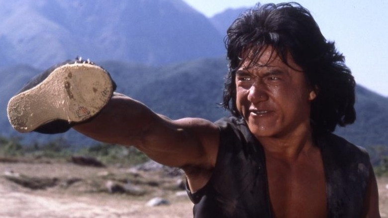 Jackie Chan training with a shoe on his hand in The Young Master