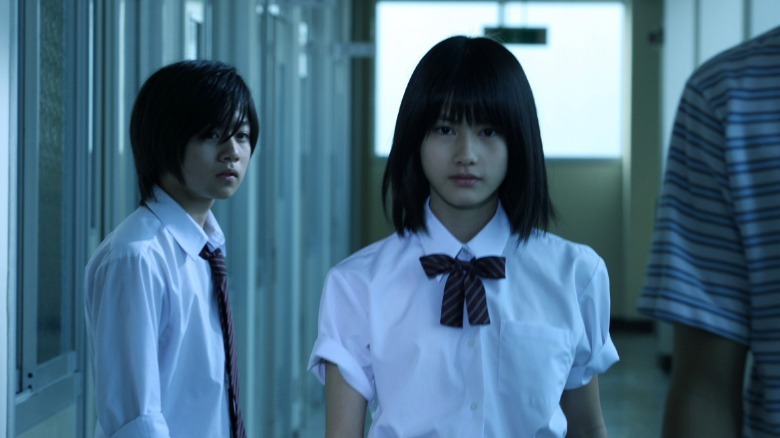 confessions schoolgirl walks down hallway