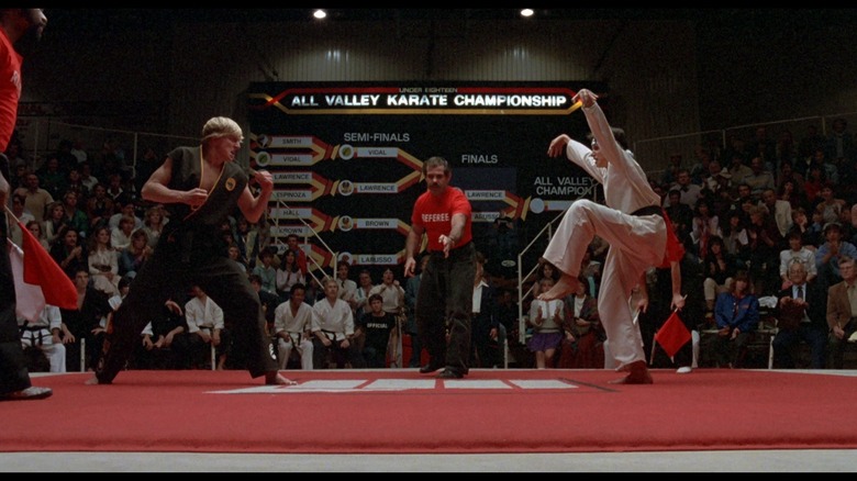 Daniel LaRusso prepares to use a crane kick on Johnny Lawrence in The Karate Kid