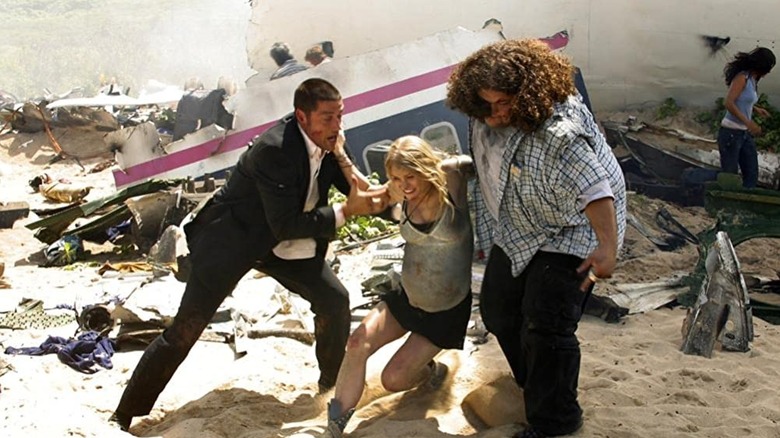 Jack and Hurley help Shannon on beach Lost