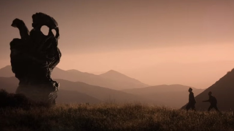 two figures bizarre landscape