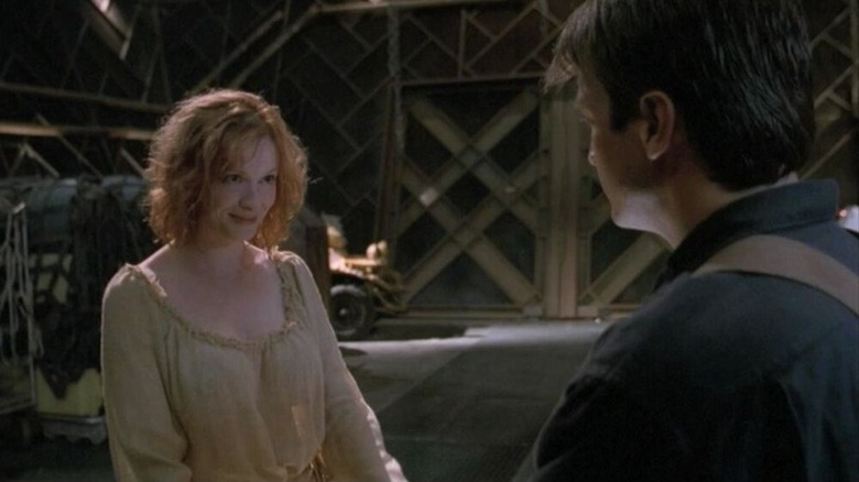 Christina Hendricks Nathan Fillion standing inside ship