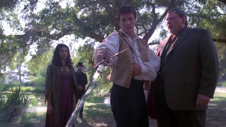 Monica Baccarin Nathan Fillion outside