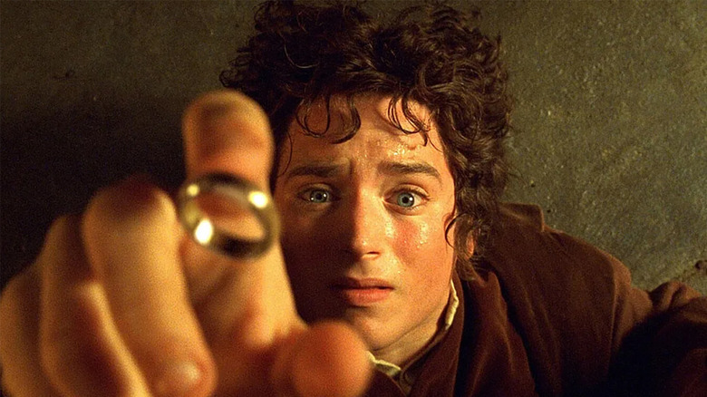 Frodo reaching for the ring in Lord of the Rings: The Fellowship of the Ring