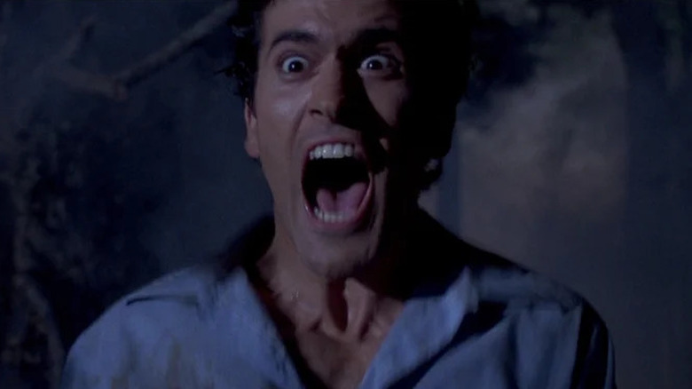 Ash Williams (Bruce Campbell) screams wildly in Evil Dead II
