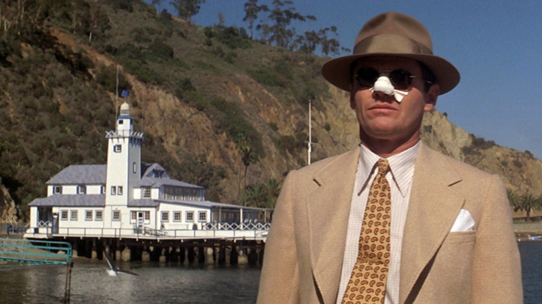 Jack Nicholson stands on dock