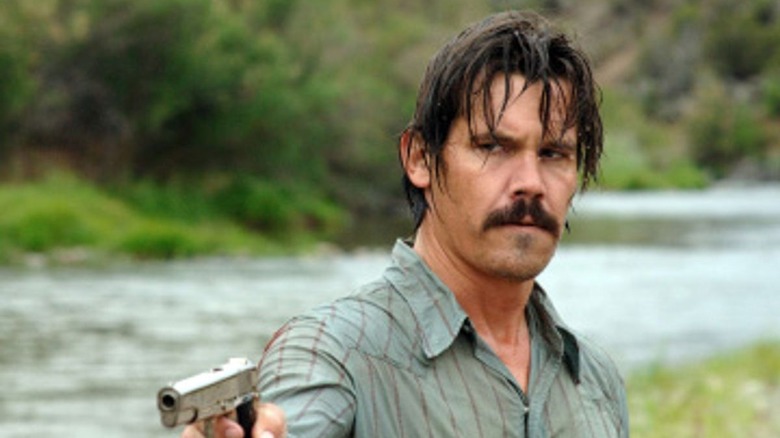 Josh Brolin points gun
