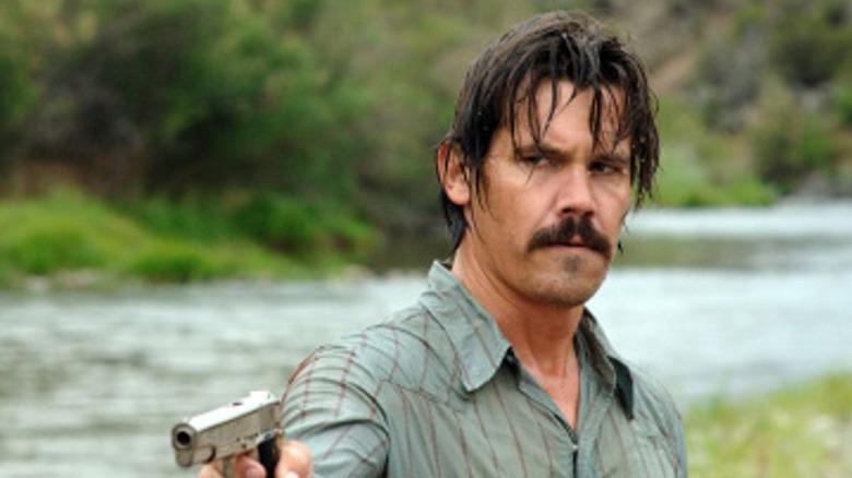 Josh Brolin points gun
