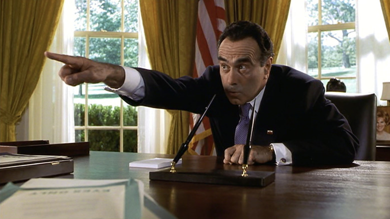 Dan Hedaya as Richard Nixon pointing in the Oval Office in Dick