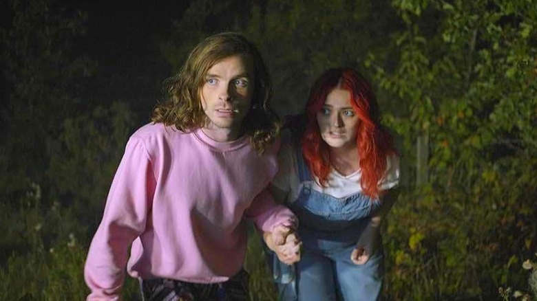 Castor Oyl and Cylinda are shown by their way through the forest 