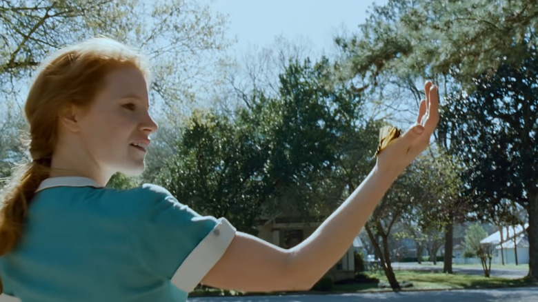 Butterfly landing on Jessica Chastain's arm