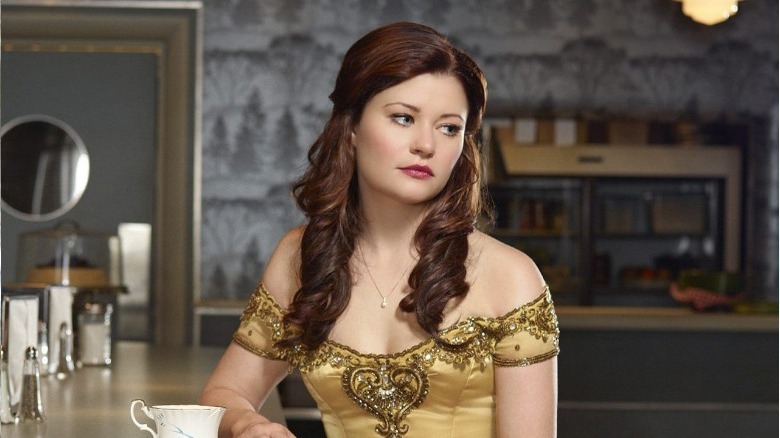 Belle in her yellow dress at a coffee shop