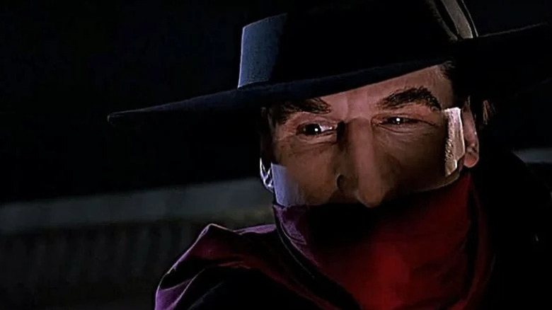 A close up of The Shadow (Alec Baldwin) in "The Shadow."