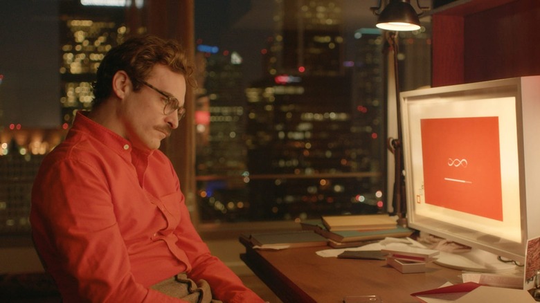 Joaquin Phoenix staring at computer