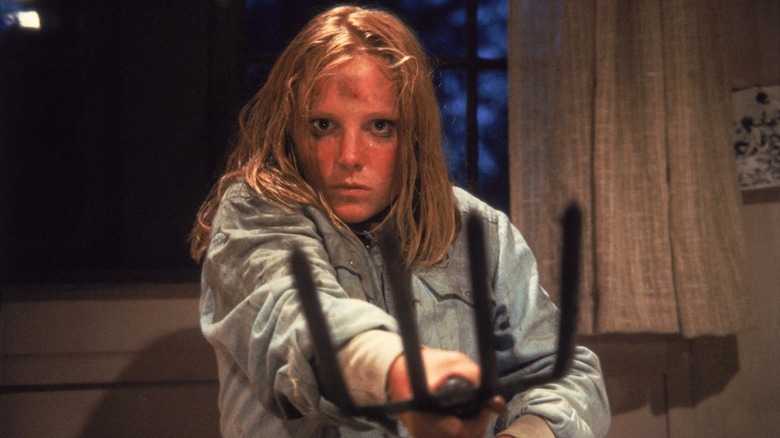 Ginny Field holding a pitchfork