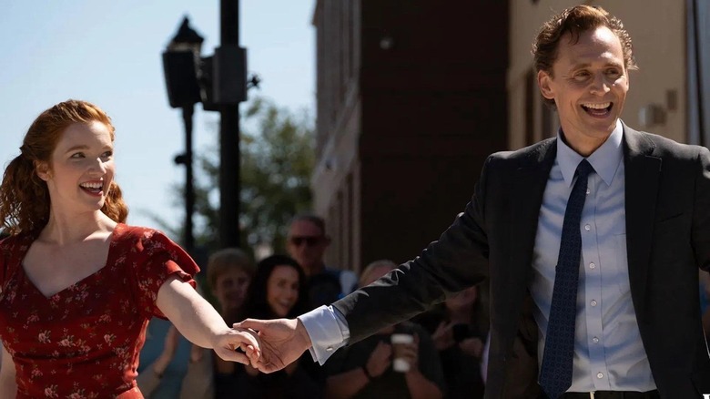 Annalise Basso as Janice holding hands with Tom Hiddleston as Charles after their dance in The Life of Chuck