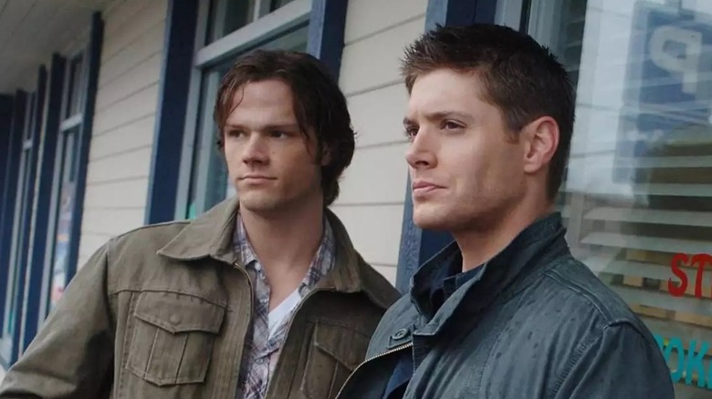 Sam and Dean standing outside building Supernatural