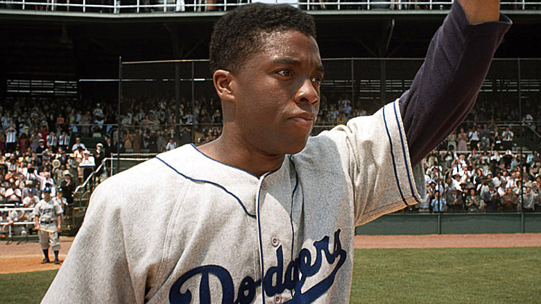 Chadwick Boseman as Jackie Robinson in 42