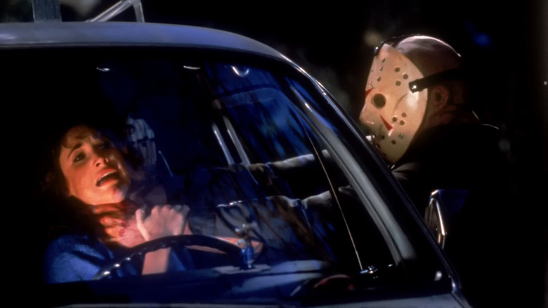 Jason Voorhees choking a girl through a car window in Friday the 13th: Part 3