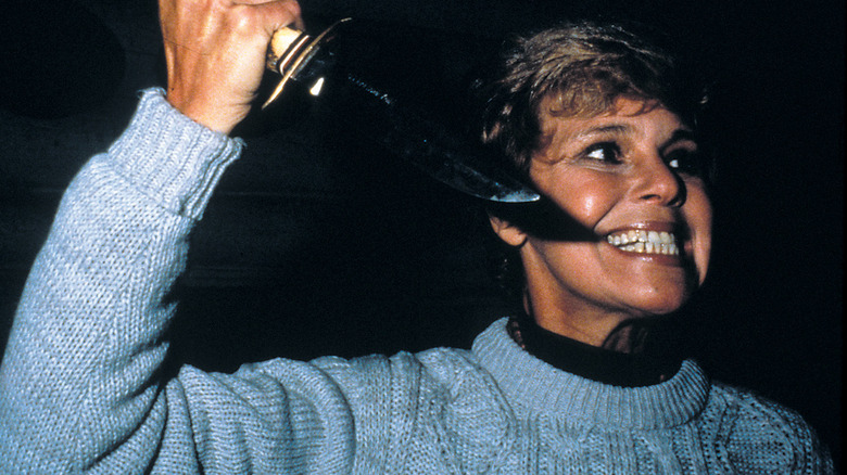 Pamela Voorhees holding a knife with an evil grin in Friday the 13th (1980)