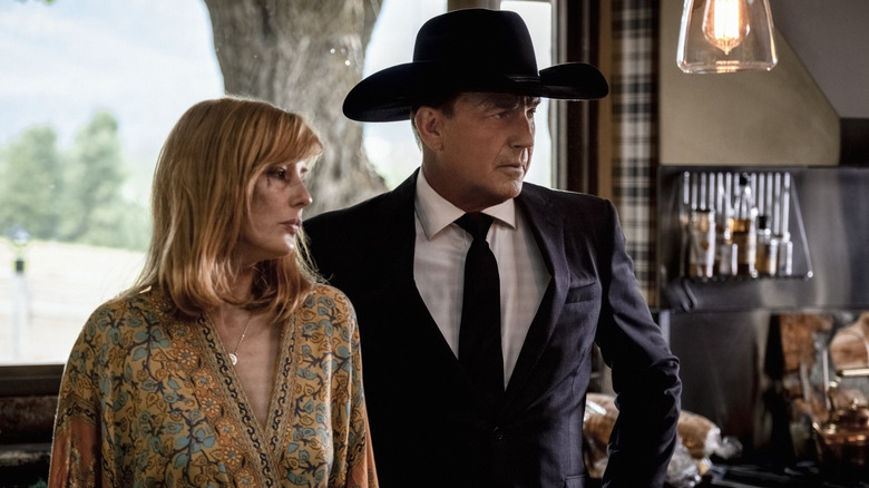 Kelly Reilly as Beth Dutton with bruised eyes standing with Kevin Costner as John Dutton in the Yellowstone season 3 episode You're the Indian Now