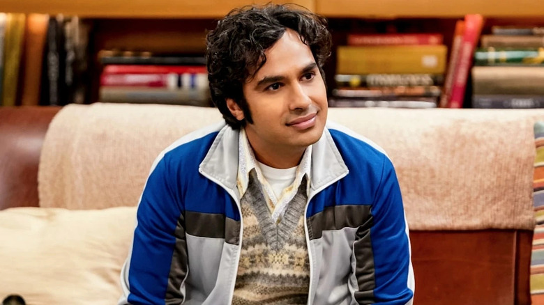 Raj in a blue jacket smiling on The Big Bang Theory