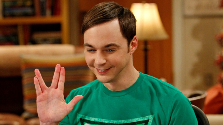 Sheldon doing the Klingon Salute and smiling on The Big Bang Theory