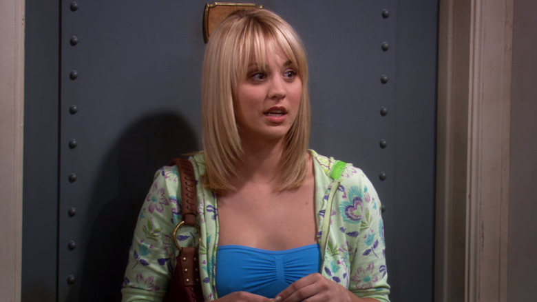 Kaley Cuoco's Penny standing by the door in the Big Bang Theory episode The Fuzzy Boots