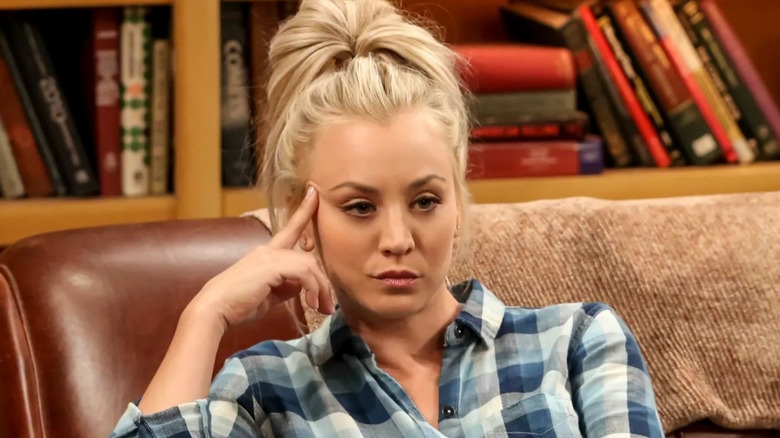 Penny looking annoyed on the couch on The Big Bang Theory
