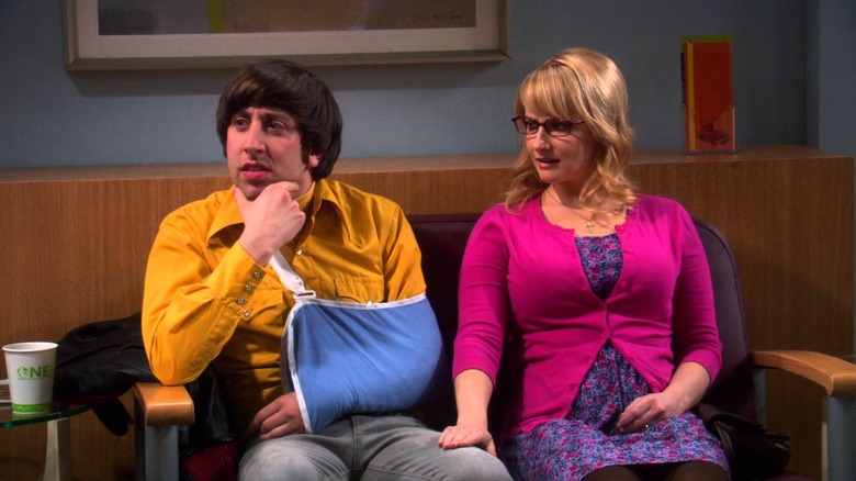 Howard wears ropes with Bernadette next to him on the theory of the big explosion