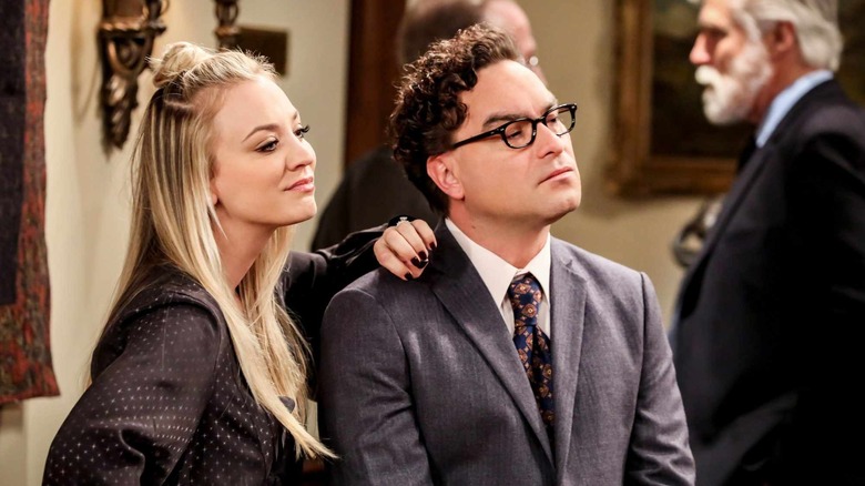 Penny with her hand on Leonard's shoulder on The Big Bang Theory