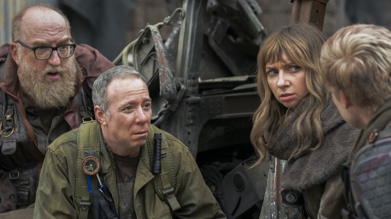 Stuart, Bert, and Denise crouched in a post-apocalyptic setting in Stuart Fails to Save the Universe
