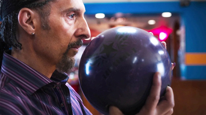 John Turturro as Jesus with his purple bowling ball in The Jesus Rolls