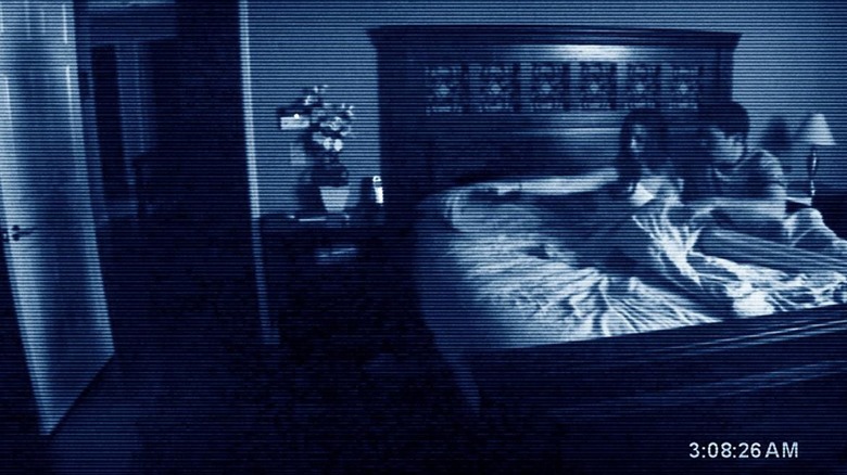 Couple in bed see shadow