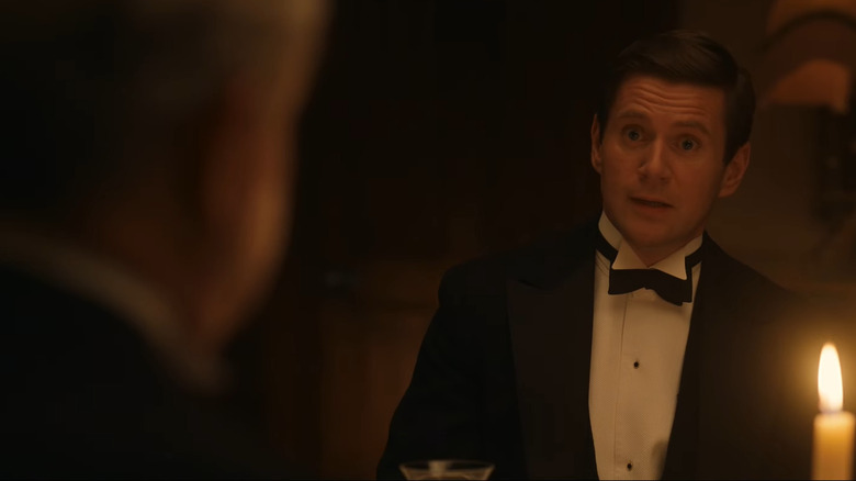 The Earl of Grantham listening to Tom Branson at the dinner table in Downton Abbey: The Grand Finale