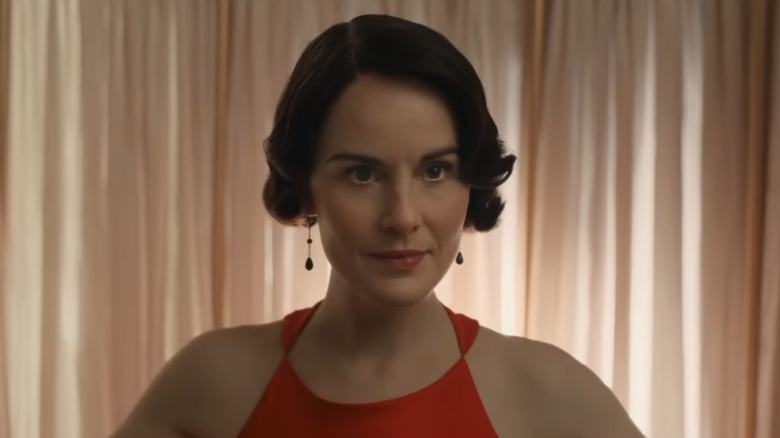 Lady Mary posing in a red dress in Downton Abbey: The Grand Finale