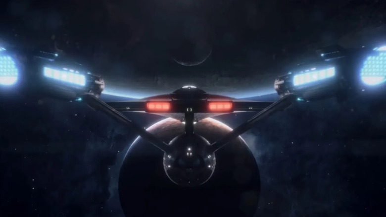The Enterprise approaching a planet in the opening titles for Star Trek: Strange New Worlds
